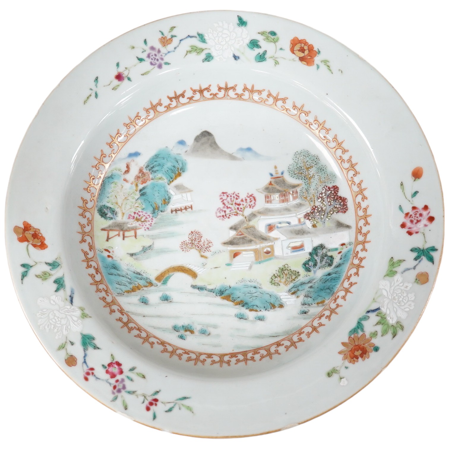 A Chinese Qianlong famille rose soup plate decorated with a landscape, diameter 23cm. Condition - fair to good